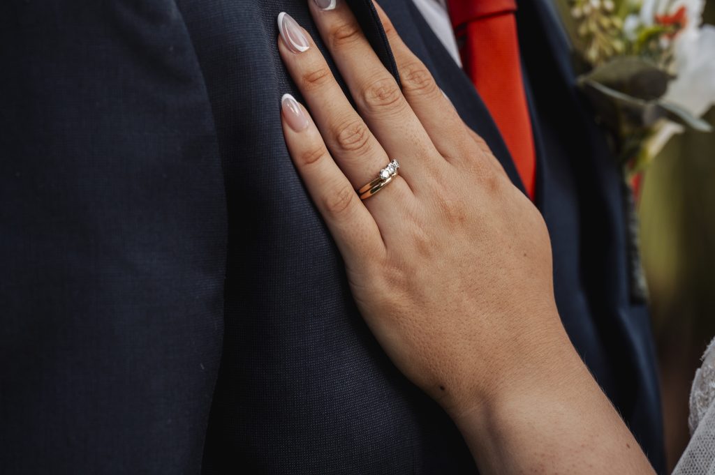 Close up of Brides hand with engagement ring on