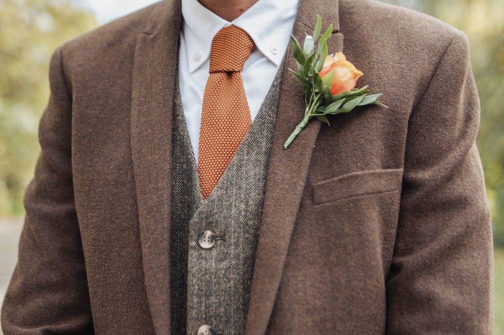 Close up of Grooms suit with button hole